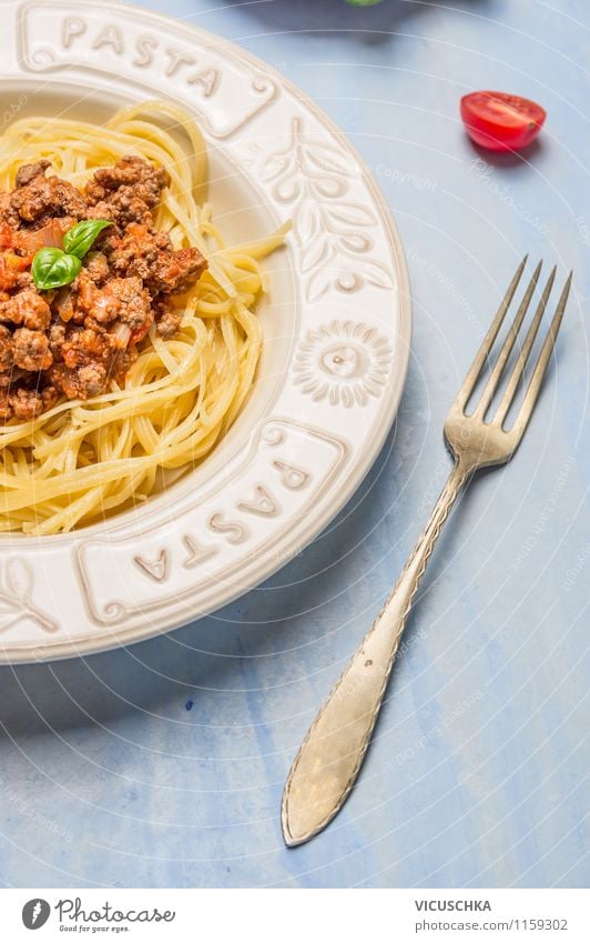 Spaghetti Bolognese in plate with fork Food Meat Vegetable Dough Baked goods Herbs and spices Nutrition Lunch Banquet Organic produce Diet Italian Food Crockery