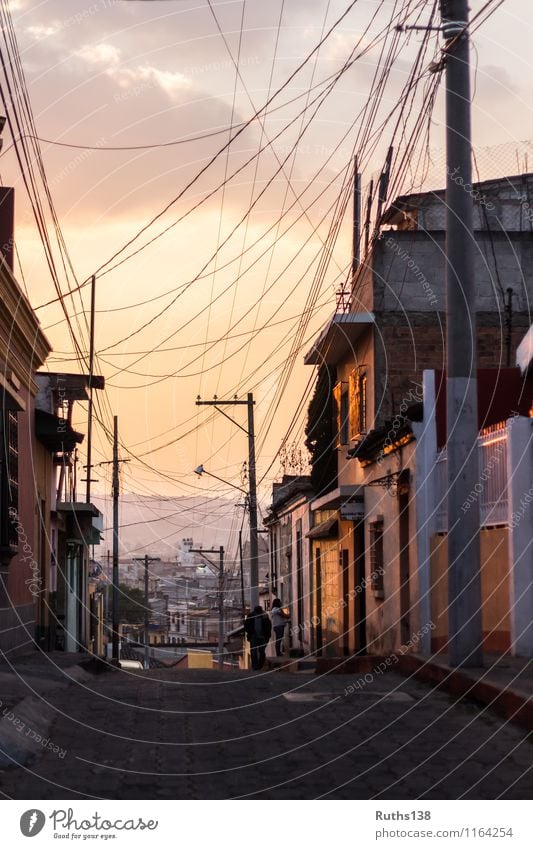 Sunset in a typical street of Xela in Guatemala Town Populated House (Residential Structure) Wall (barrier) Wall (building) Street Far-off places Gold Orange