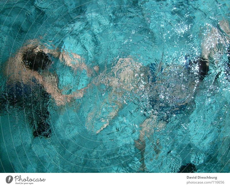 Battle for the snorkel Abstract Swimming & Bathing Dive Surface of water Whirlpool Turquoise 2 people Swimming pool Unrecognizable Unidentified Anonymous