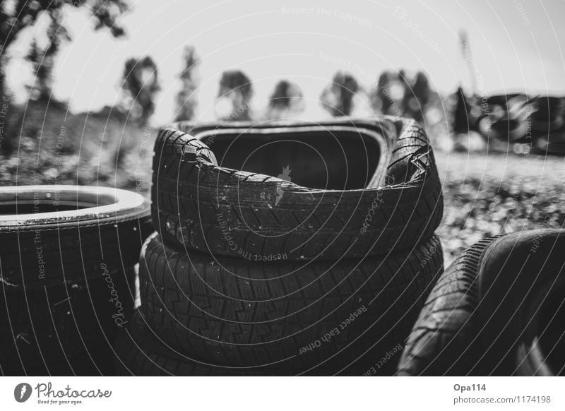 tire stacks Tire tread Rubber Old Black White Transience "Tyres Stack Storage Dented dent Broken Profile Black & white photo Exterior shot Close-up Detail