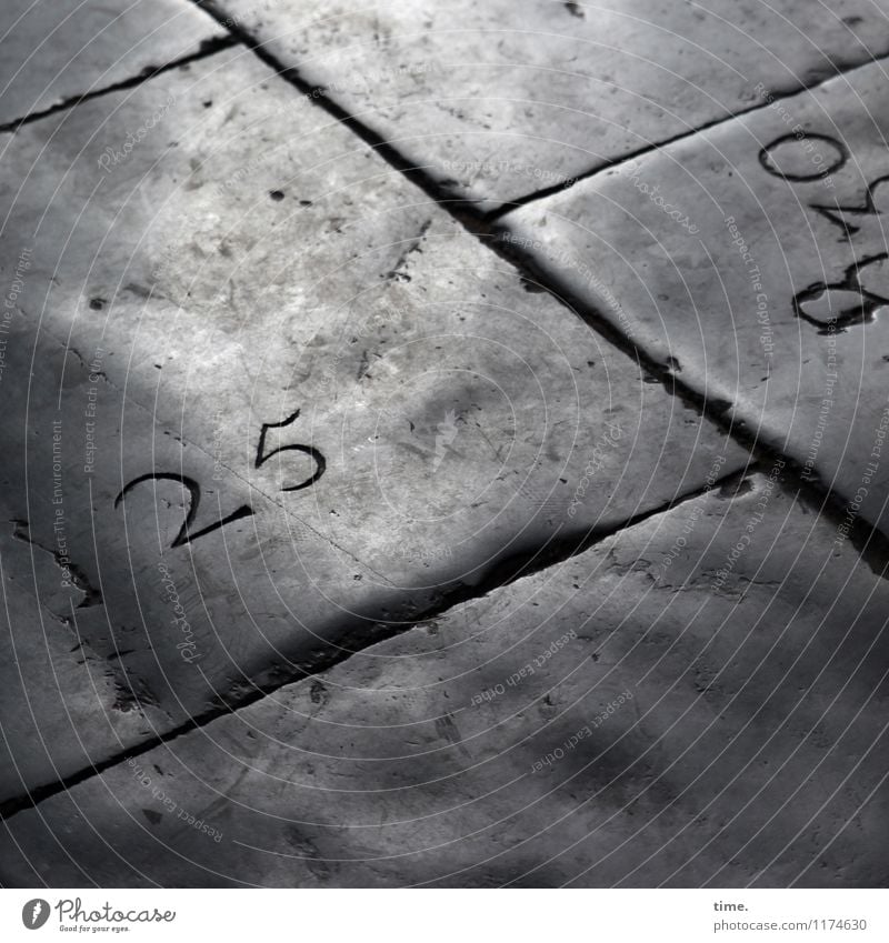 That's an inconspicuous detail. 25. Church Lanes & trails Floor covering Paving tiles Tombstone Seam Stone Digits and numbers Line Old Authentic Dark