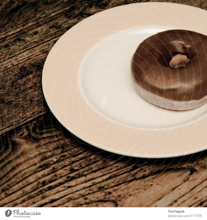 Donutella Table Wooden table Wood grain Texture of wood Kitchen Plate Edge of a plate Round Fat Unhealthy Circle Circular Yeast Baked goods Tartlet Nutrition