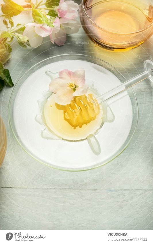Enjoy golden honey with tea Food Dessert Candy Organic produce Vegetarian diet Diet Beverage Tea Plate Cup Spoon Style Design Alternative medicine