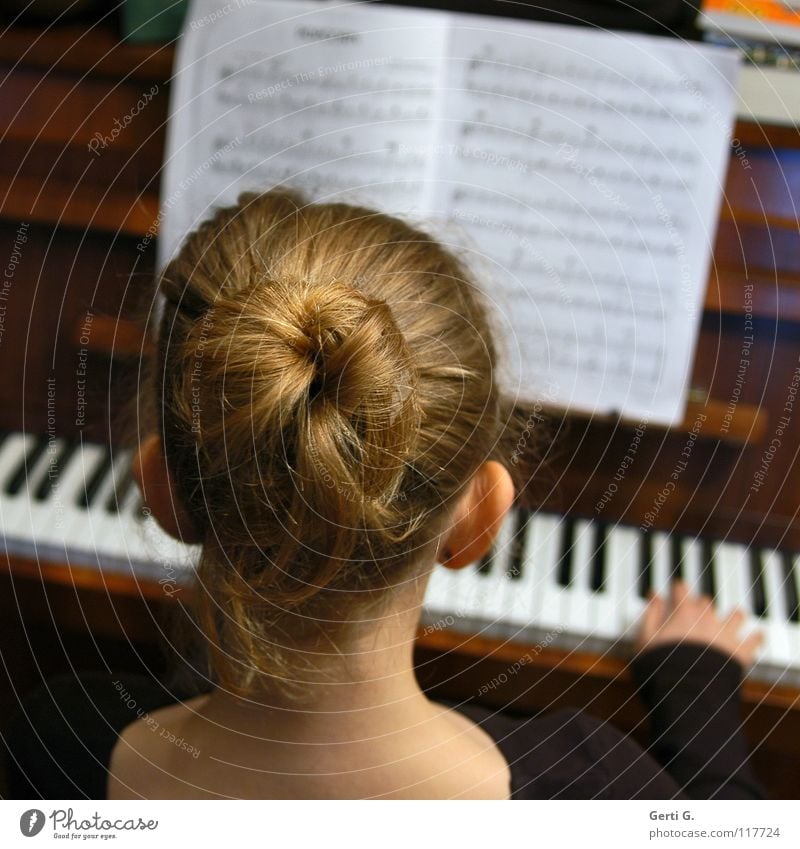 PopCorn Girl Child Chignon Hair and hairstyles Blonde Pinned up hairstyle Wood Hand Fingers Door handle Chord Third Piano Music book Assault Keyboard instrument