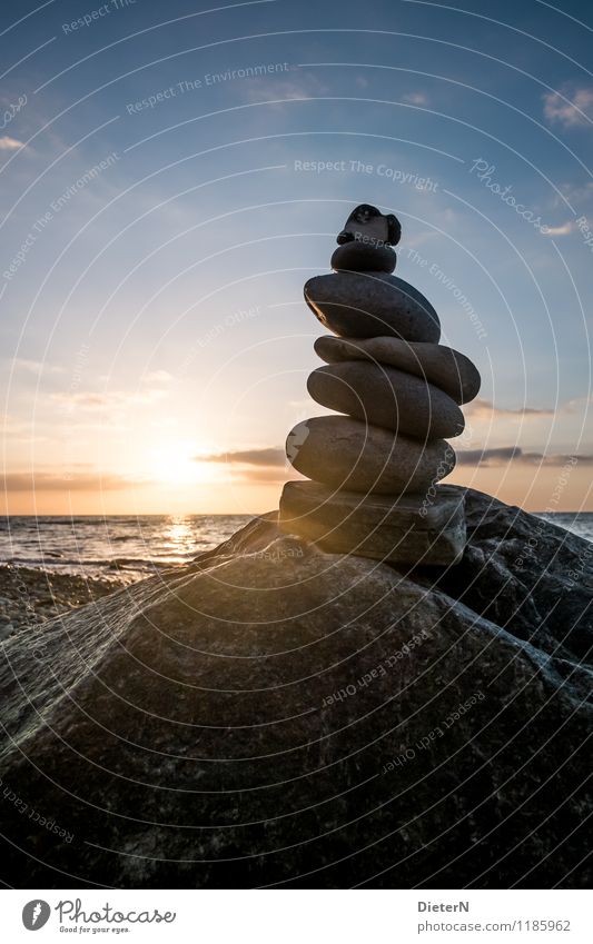 Towered Environment Nature Landscape Water Sky Clouds Sunrise Sunset Beautiful weather Waves Coast Beach Baltic Sea Ocean Blue Yellow Black Cairn Stone Rock
