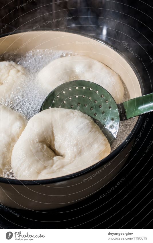 Cooking bagels in vintage saucepan Bread Breakfast Kitchen Factory Hand Stove & Oven Make Fresh White Tradition Bagel Bakery food dough Flour Home-made