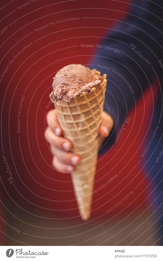 ice Dessert Ice cream Candy Chocolate Nutrition Child Hand 1 Human being Delicious Sweet Brown Red Chocolate ice cream Colour photo Exterior shot Close-up Day