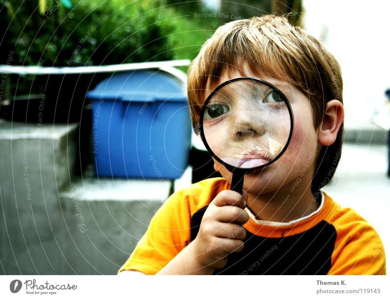 Through The Looking Glass II Child Boy (child) Enlarged Hand Eyeglasses Suspect Portrait photograph Investigate National security Tracks Reading Search
