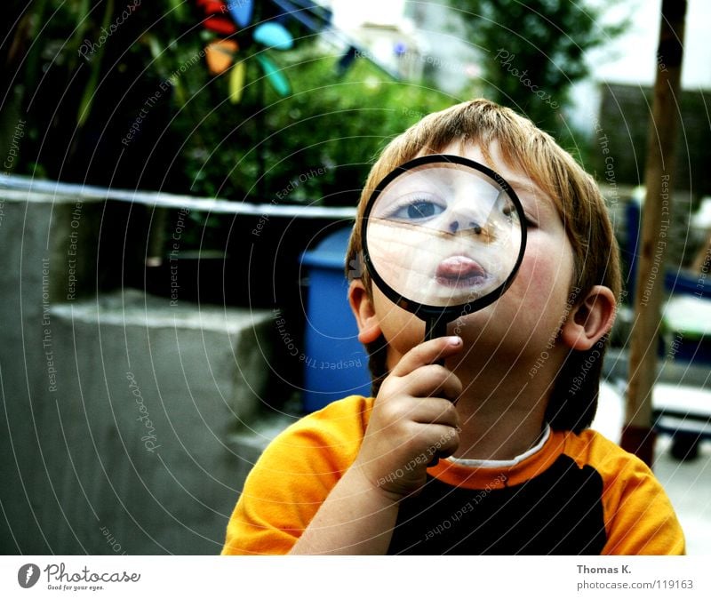 Through The Looking Glass III Child Boy (child) Enlarged Hand Eyeglasses Suspect Portrait photograph Investigate National security Tracks Reading Search