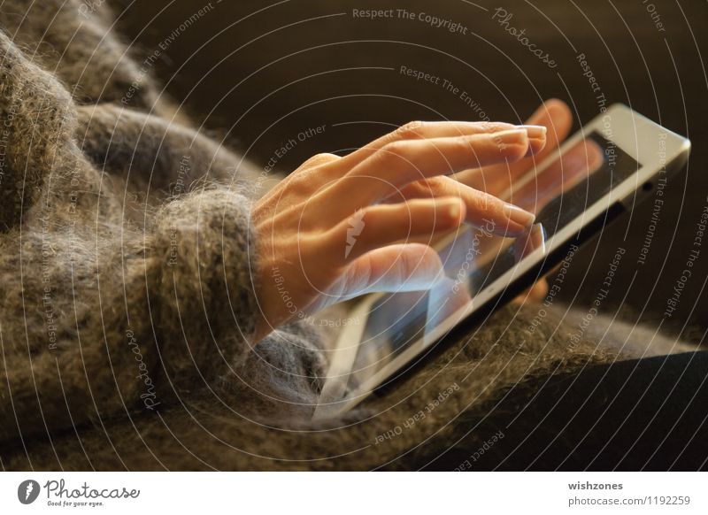 Woman Hands working on a Touch Pad PDA Computer Notebook Information Technology Internet Feminine Fingers 30 - 45 years Adults Sweater Jacket Movement