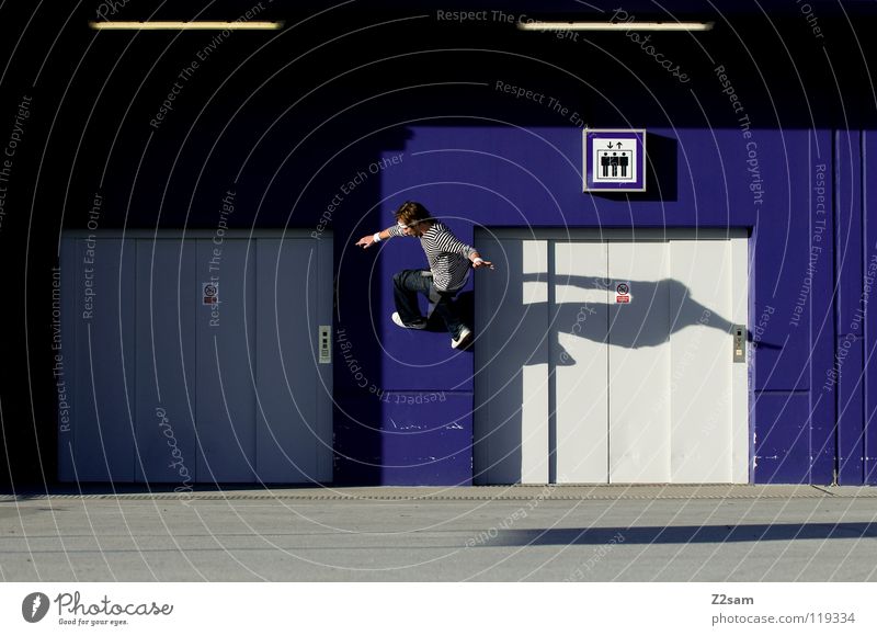 wallride Wallride Wall (building) Going Jump Action Elevator Concrete Roof Striped Youth culture Light Man Parking level Parking garage Signs and labeling