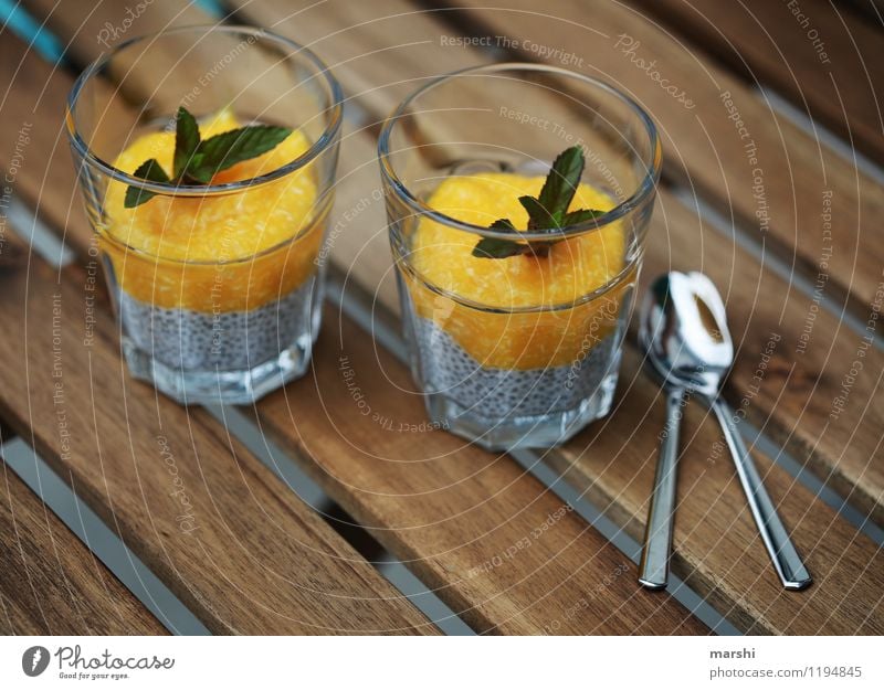 chia pudding Food Dessert Ice cream Candy Nutrition Eating Emotions Moody Pudding Glass Delicious Healthy Eating Fitness Spoon Mint Mango Wooden table
