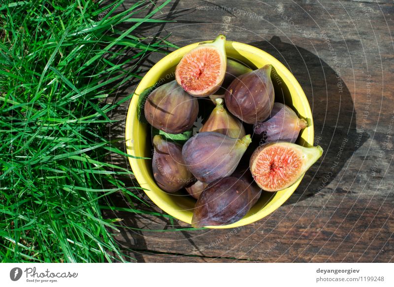 Figs in yellow bowl Fruit Dessert Nutrition Bowl Exotic Table Nature Autumn Fresh Natural Juicy food figs Rustic sweet wood Raw wooden healthy ripe Organic