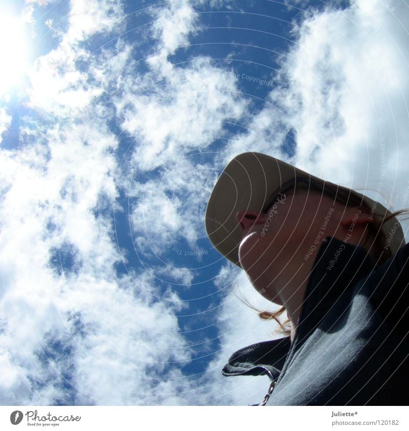 Looking ahead... Woman Hiking Clouds Baseball cap Dream Lighting Americas Sky Aviation Summer climbing Marvel Sun daydreaming Colour photo Clouds in the sky