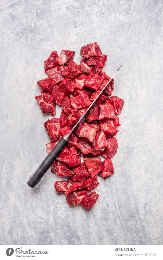 Cut meat for goulash into cubes Food Meat Nutrition Lunch Dinner Banquet Organic produce Diet Knives Style Design Healthy Eating Appetite Top Protein Raw Beef