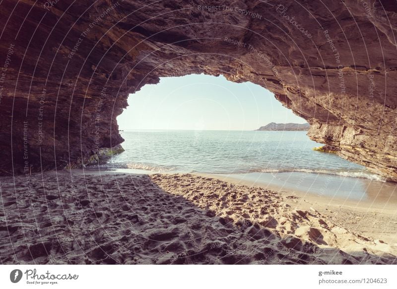 Cave at the beach Nature Sand Air Water Sky Summer Beach Ocean Island Warmth Blue Yellow Mysterious Hiding place Vantage point Uniqueness Colour photo