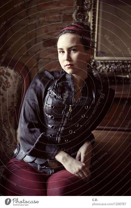 Portrait from another time (in color) Young woman Youth (Young adults) 1 Human being 18 - 30 years Adults Jeans Leather Blouse Brunette Chignon Sit Dark