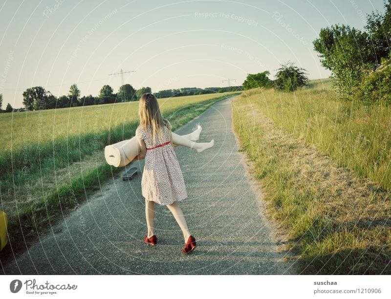 girl on a field path with bottom of a mannequin Nature Exterior shot Summer Lanes & trails Grass Child Girl Dress Mannequin Legs Abdomen Lift Carrying