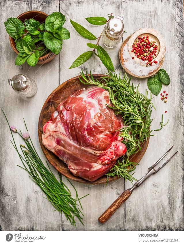 Prepare leg of lamb with fresh herbs Food Meat Herbs and spices Nutrition Dinner Banquet Organic produce Plate Bowl Fork Style Design Healthy Eating Life Table