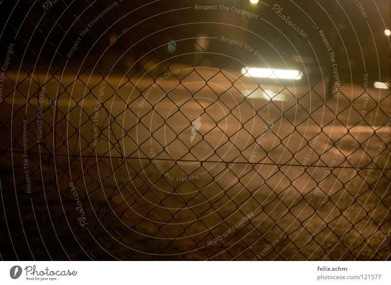 Trapped by a trap Fence Night Grating Barrier Captured Dark Vehicle Dangerous Gyroscope Transport Wire netting fence Mysterious Traffic infrastructure