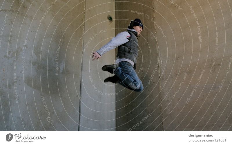 urban freestyle Parkour Concrete Wall (building) Man Cap Gray Drainage Jump Hover Winter Cold Dirty Vest Knee Empty Weightlessness Ghetto Freestyle