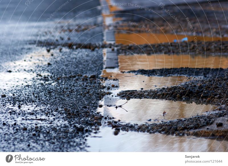 After the rain falls Puddle Roadside Tar Edge Reflection Gravel Gray Traffic infrastructure Water Rain Dirty Street Floor covering Stone Deserted Detail