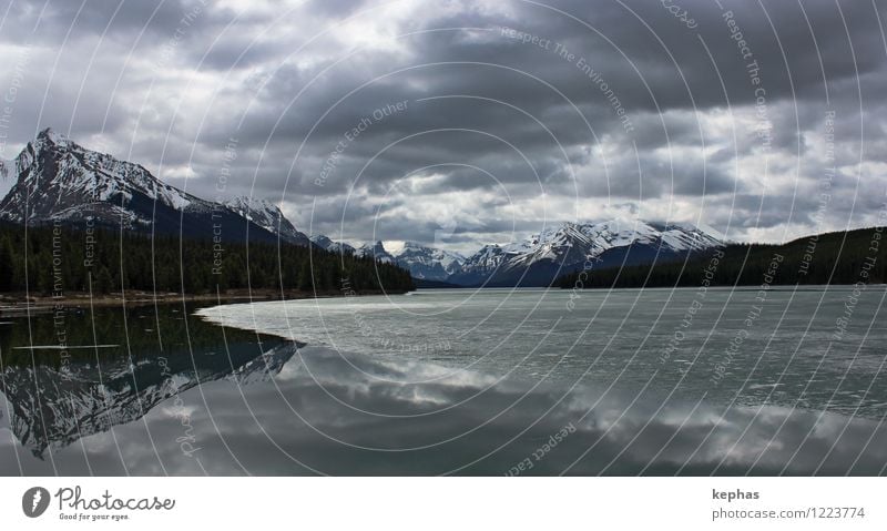 end-time Vacation & Travel Mountain Landscape Water Clouds Gale Ice Frost Rocky Mountains Peak Snowcapped peak Lake Lake Maligne Threat Gray Wanderlust Fear