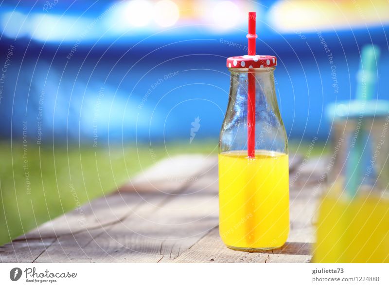 Summer with orange lemonade Beverage Drinking Cold drink Lemonade Bottle Straw Glassbottle Lifestyle Joy Relaxation Leisure and hobbies Summer vacation Garden