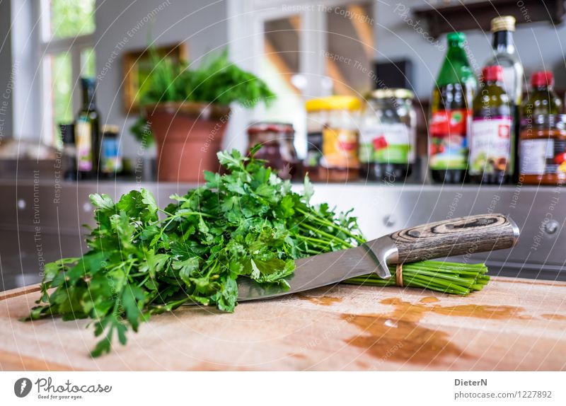 cut Food Herbs and spices Cooking oil Nutrition Organic produce Knives Brown Green Silver Kitchen Bottle Wooden board Steel Parsley Bundle Colour photo