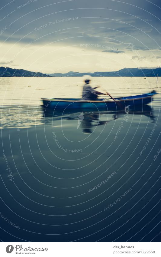 blur Masculine 1 Human being Storm clouds Mountain Lakeside Movement Simple Infinity Gloomy Endurance Loneliness Relaxation Stagnating Rowing Subdued colour
