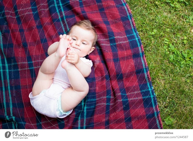 Baby lying on blanket in the garden Summer Girl 1 Human being 0 - 12 months Nature Spring Grass Garden Park Small Cute Green Checkered kid Colour photo