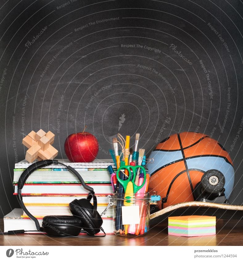 School and sport accessories on desktop Fruit Apple Desk Sports Ball Blackboard Book Education Relaxation background basketball Blank Crayon empty Headphones