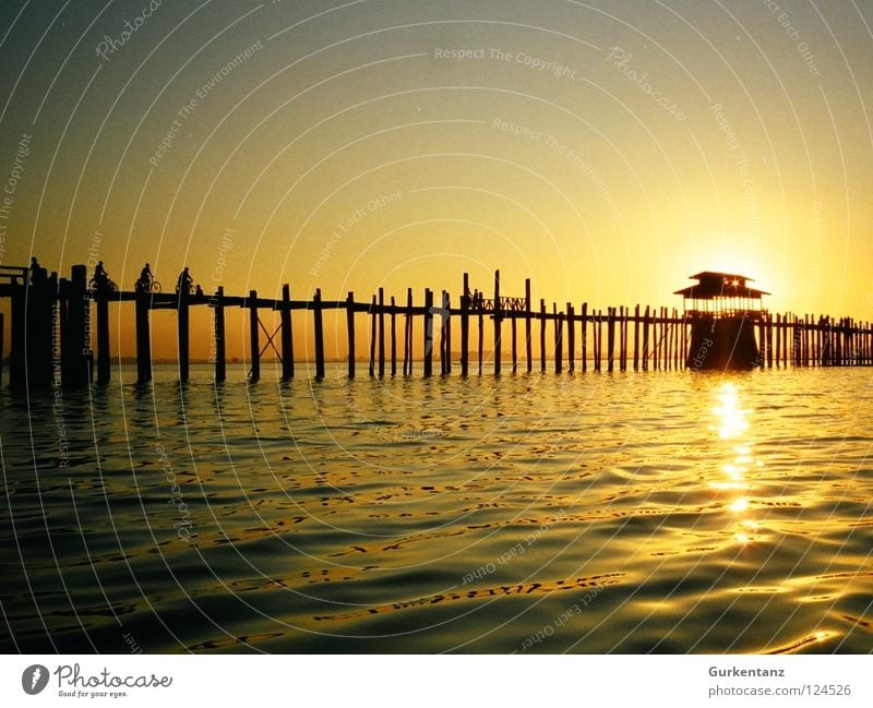 solar power Myanmar Mandalay Teak Wood Wooden bridge Asia Dusk Lake Back-light Light Bridge Celestial bodies and the universe u-leg Pole Evening Water Shadow