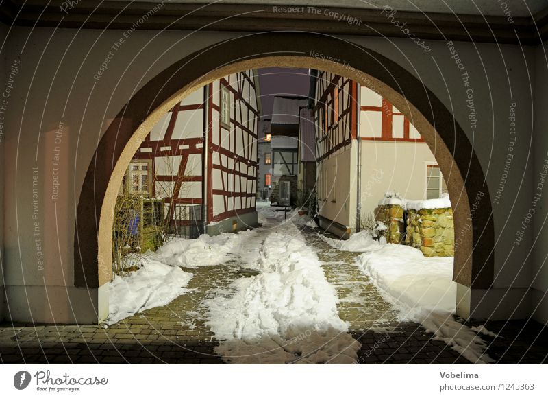 Archway in winter Small Town Old town House (Residential Structure) Wall (barrier) Wall (building) Brown Black White Colour photo Exterior shot Deserted