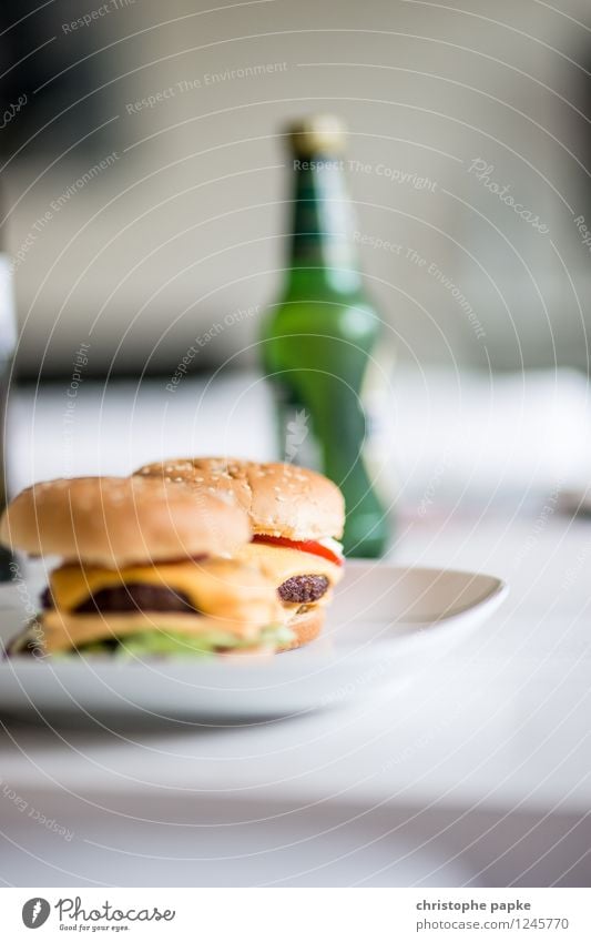 Burger and Beer Food Nutrition Lunch Dinner Fast food Beverage Alcoholic drinks Plate Flat (apartment) Table Living room Delicious Hamburger Cheeseburger