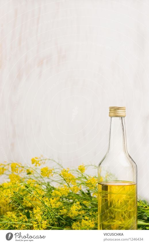 Rapeseed oil in bottle on white wood background Food Herbs and spices Cooking oil Nutrition Organic produce Vegetarian diet Diet Bottle Style Design