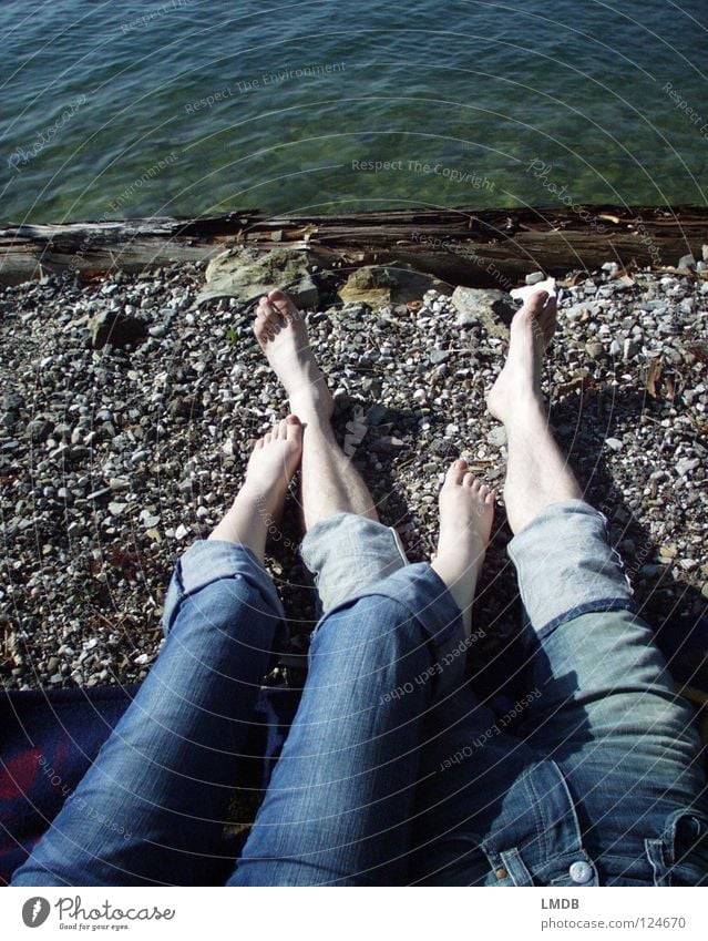 Make blue Pants Relaxation 2 Friendship Lake Bathing place Calm Dream Together Love Jeans Feet Legs Couple Sand Stone Coast Sun Lie stretch Gravel In pairs