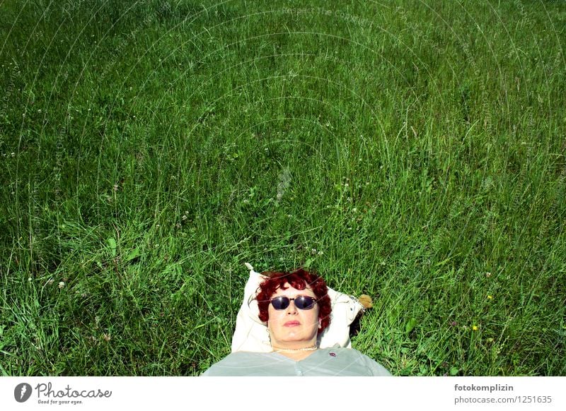 Woman face with sunglasses on green meadow area relax Relaxation Serene Sunglasses relaxed Rest Breathe Face Lie Dream Contentment Easygoing Meadow Sleep