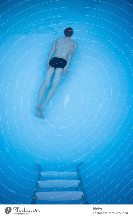 A young man diving at the bottom of a pool. Bird's eye view Young man Spa Swimming pool Swimming & Bathing book cover go underground Dive Masculine Style