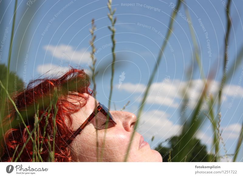 Sunbathing between blades of grass - woman face with sunglasses Face Healthy Wellness Well-being Lie Relaxation To enjoy Woman Sunglasses sunbathe