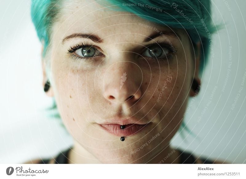 Very close portrait of young woman with turquoise hair and lip piercing Young woman Youth (Young adults) Hair and hairstyles Face 18 - 30 years Adults Piercing
