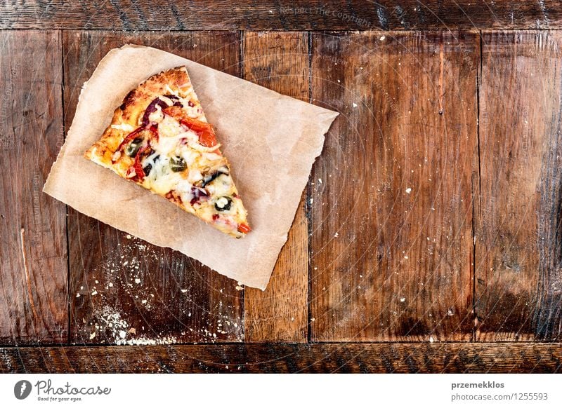 Slice of pizza on piece of paper Food Vegetable Dinner Fast food Table Paper Fresh Copy Space cuisine Home Home-made Horizontal Meal Pizza popular prepared