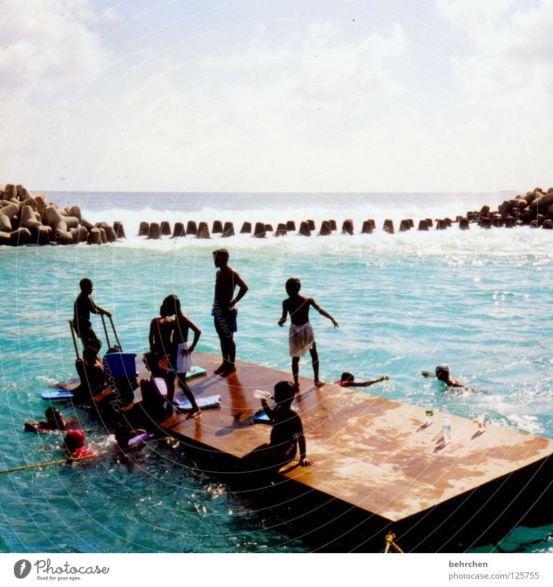 learning to swim in maldivian Colour photo Exterior shot Joy Happy Contentment Swimming & Bathing Vacation & Travel Freedom Summer Sun Ocean Island Child