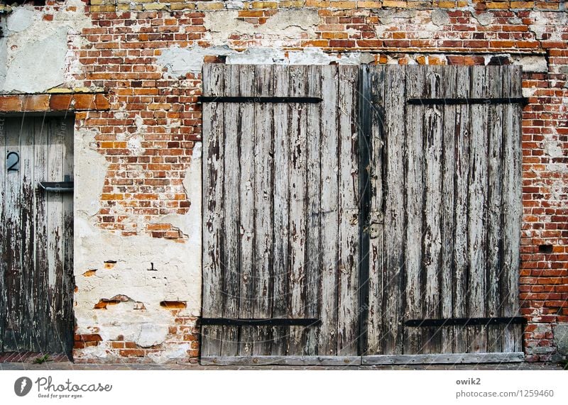 portal Wall (barrier) Wall (building) Facade Brick wall Brick facade Garage door Wooden gate Digits and numbers 2 House number Old Decline Transience