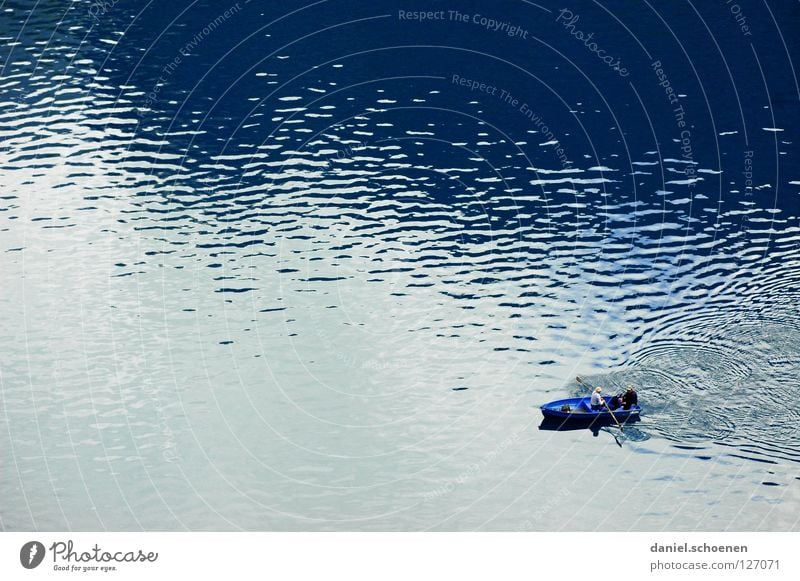 Angler's dream in blue Lake Watercraft Leisure and hobbies Fishing (Angle) Waves Background picture Pattern Rowing Rowboat Calm Loneliness Surface Mountain lake