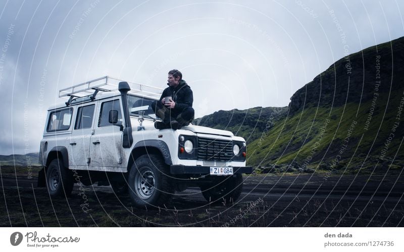 Coffee break Iceland Young man Youth (Young adults) 1 Human being Landscape Earth Clouds Bad weather Storm Fog Moss Hill Rock Volcano jeep To enjoy Wanderlust