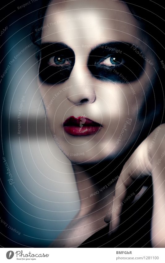 Made up woman looks out of window in shadow Make-up Hallowe'en Human being Woman Adults 1 Creepy Sadness Grief Death Guilty Shame Remorse Fear Dangerous