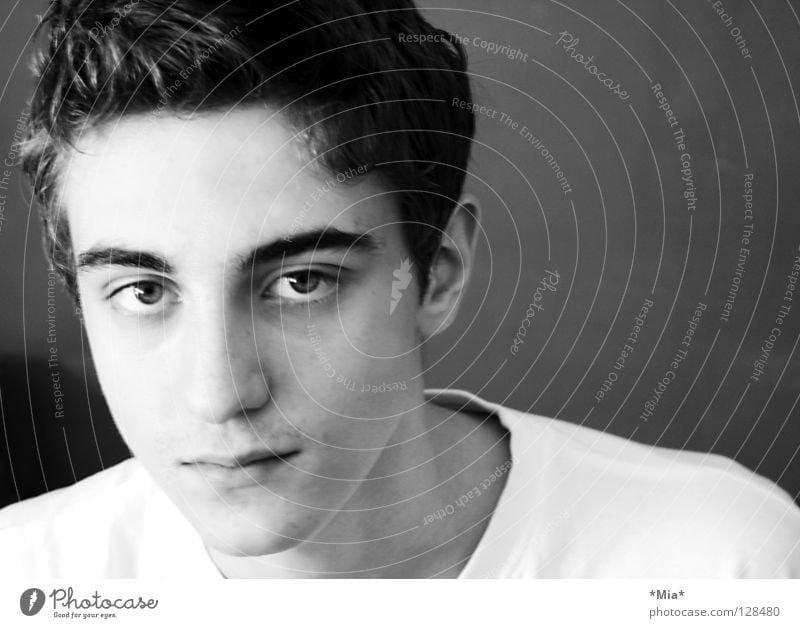 Boy with a white T-shirt in front of a dark wall Eyebrow Side White Black Left Landscape format Black & white photo Guy Eyes Face Nose Mouth Ear