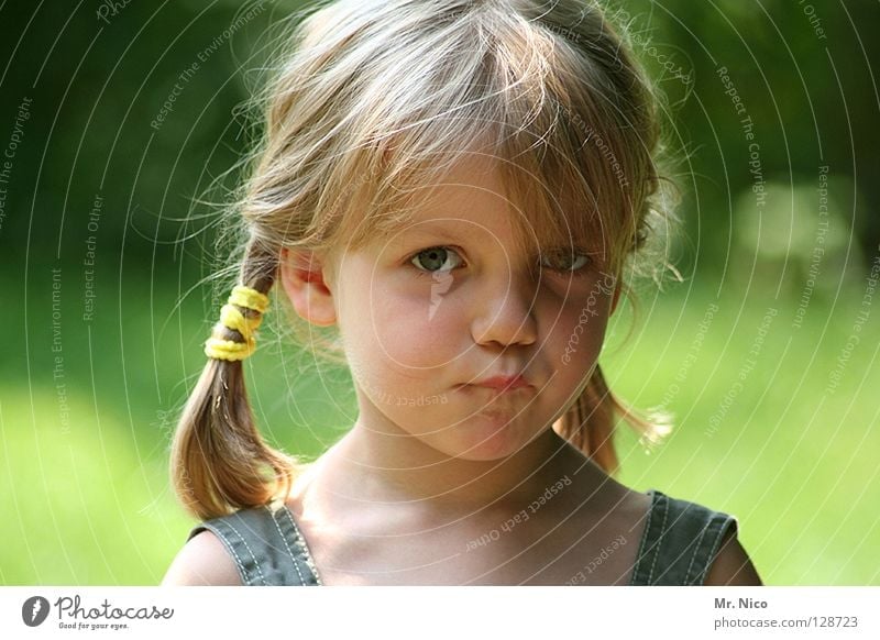 Ute Schnute Girl pretty Blonde Long-haired Cute Facial expression Braids Innocent Green Carrier Disheveled Looking Sulk Pout Insulted Child Emotions Mouth Face