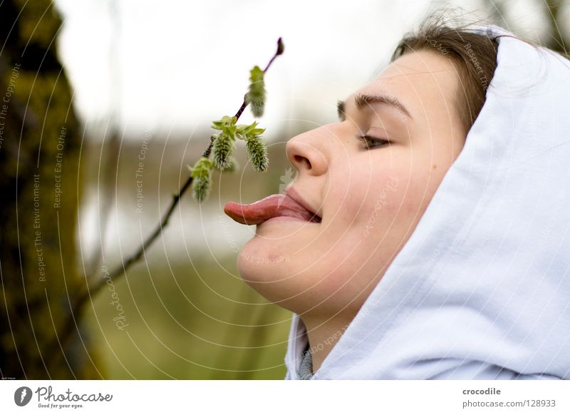 forest fruits Stick out Spring Hooded (clothing) Lake Lake Baggersee Tree Wake up Blur Woman Joy Macro (Extreme close-up) Close-up Tongue Nose tip of tongue
